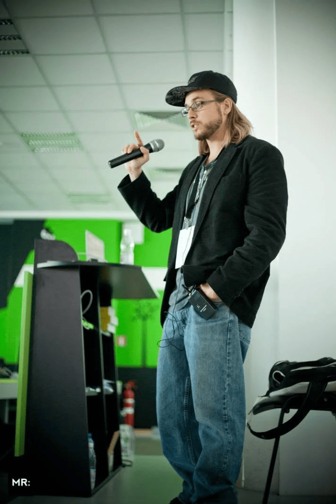 Brian Messenlehner speaking with a microphone at WordCamp Sofia 2013